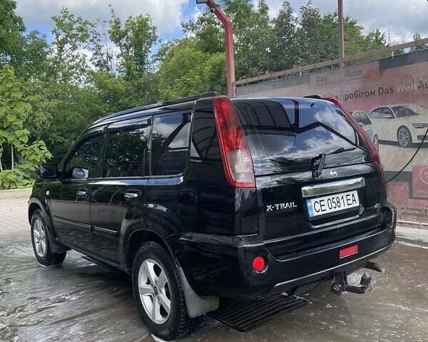 Черный Ниссан ИксТрейл, объемом двигателя 2.2 л и пробегом 300 тыс. км за 7000 $, фото 4 на Automoto.ua