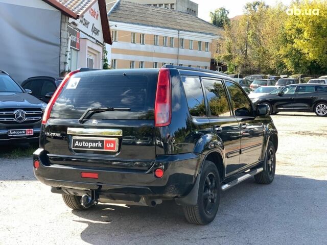 Черный Ниссан ИксТрейл, объемом двигателя 2.5 л и пробегом 295 тыс. км за 6890 $, фото 4 на Automoto.ua