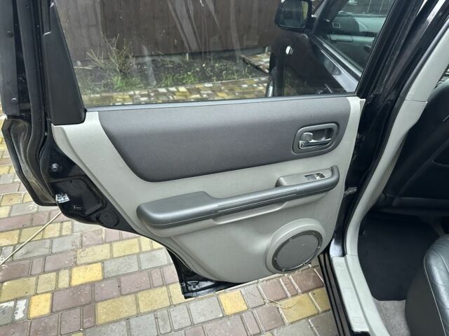 Черный Ниссан ИксТрейл, объемом двигателя 2.2 л и пробегом 168 тыс. км за 6699 $, фото 19 на Automoto.ua