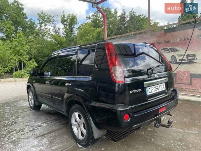 Черный Ниссан ИксТрейл, объемом двигателя 2.2 л и пробегом 300 тыс. км за 7000 $, фото 1 на Automoto.ua