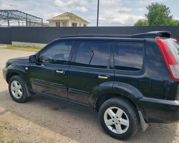 Черный Ниссан ИксТрейл, объемом двигателя 2.18 л и пробегом 210 тыс. км за 6400 $, фото 5 на Automoto.ua