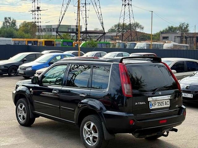 Черный Ниссан ИксТрейл, объемом двигателя 2.2 л и пробегом 360 тыс. км за 7300 $, фото 2 на Automoto.ua