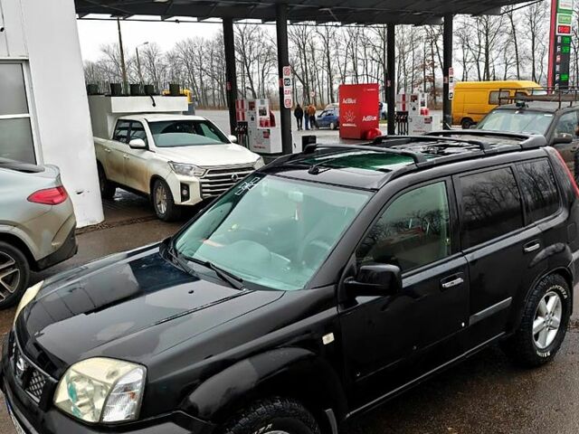 Черный Ниссан ИксТрейл, объемом двигателя 2.2 л и пробегом 100 тыс. км за 5500 $, фото 1 на Automoto.ua