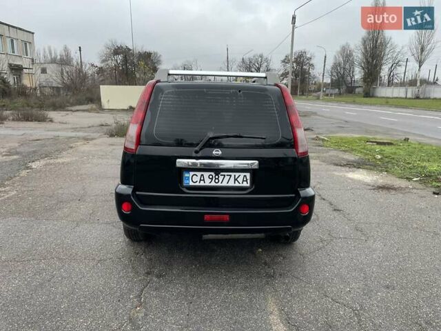 Черный Ниссан ИксТрейл, объемом двигателя 2.5 л и пробегом 285 тыс. км за 6500 $, фото 4 на Automoto.ua