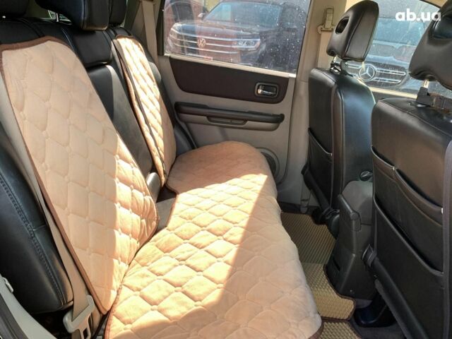 Черный Ниссан ИксТрейл, объемом двигателя 2.5 л и пробегом 295 тыс. км за 6890 $, фото 22 на Automoto.ua