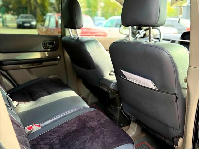 Черный Ниссан ИксТрейл, объемом двигателя 2.2 л и пробегом 360 тыс. км за 7300 $, фото 9 на Automoto.ua