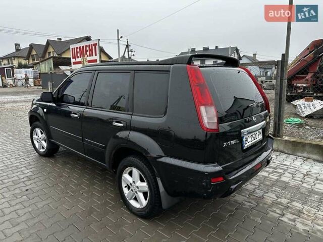 Черный Ниссан ИксТрейл, объемом двигателя 2.5 л и пробегом 282 тыс. км за 6250 $, фото 3 на Automoto.ua