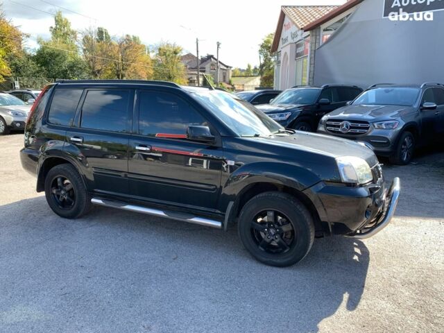 Черный Ниссан ИксТрейл, объемом двигателя 2.5 л и пробегом 295 тыс. км за 6890 $, фото 3 на Automoto.ua