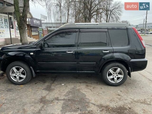 Черный Ниссан ИксТрейл, объемом двигателя 2.5 л и пробегом 285 тыс. км за 6500 $, фото 2 на Automoto.ua