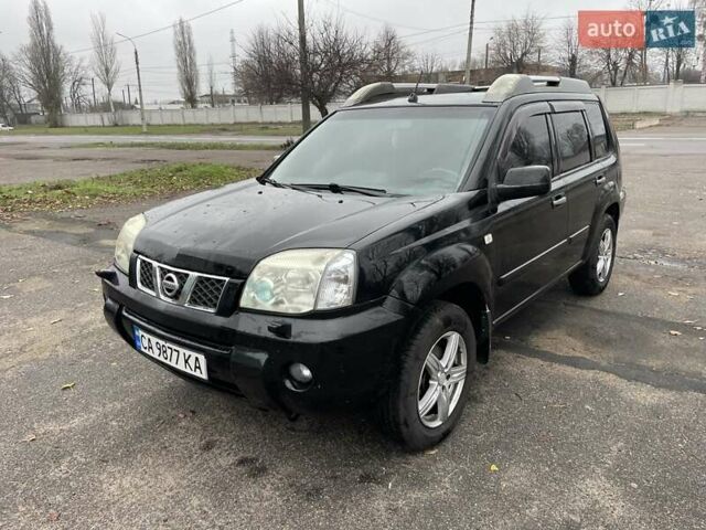 Черный Ниссан ИксТрейл, объемом двигателя 2.5 л и пробегом 285 тыс. км за 6500 $, фото 1 на Automoto.ua