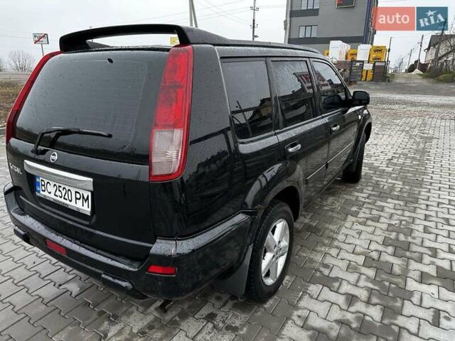Черный Ниссан ИксТрейл, объемом двигателя 2.5 л и пробегом 282 тыс. км за 6250 $, фото 5 на Automoto.ua