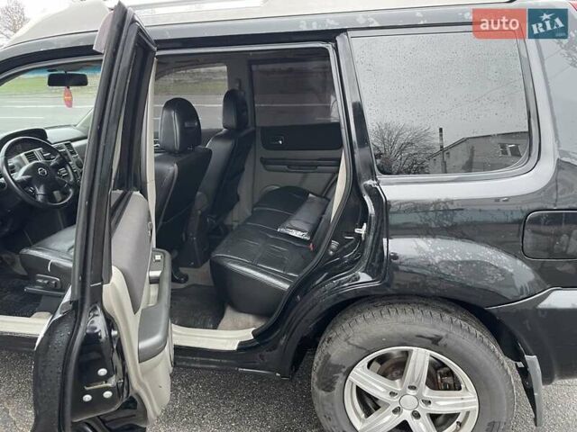 Черный Ниссан ИксТрейл, объемом двигателя 2.5 л и пробегом 285 тыс. км за 6500 $, фото 10 на Automoto.ua