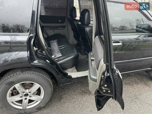 Черный Ниссан ИксТрейл, объемом двигателя 2.5 л и пробегом 285 тыс. км за 6500 $, фото 12 на Automoto.ua