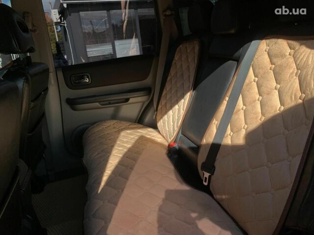 Черный Ниссан ИксТрейл, объемом двигателя 2.5 л и пробегом 295 тыс. км за 6890 $, фото 26 на Automoto.ua