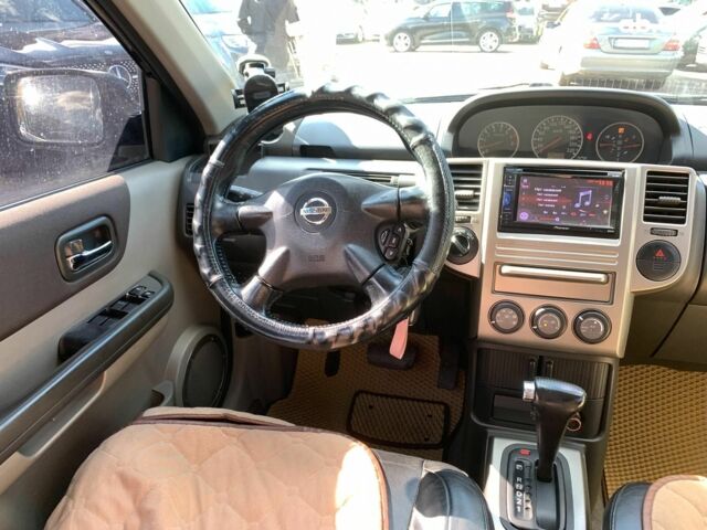 Черный Ниссан ИксТрейл, объемом двигателя 2.5 л и пробегом 295 тыс. км за 6890 $, фото 28 на Automoto.ua