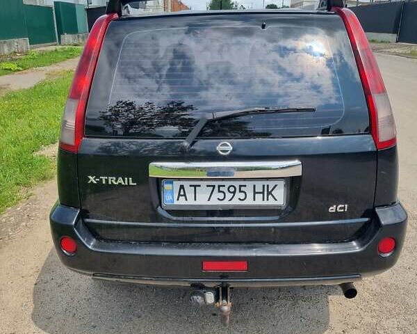 Черный Ниссан ИксТрейл, объемом двигателя 2.18 л и пробегом 210 тыс. км за 6400 $, фото 1 на Automoto.ua