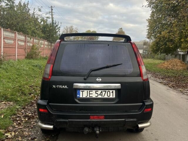 Черный Ниссан ИксТрейл, объемом двигателя 2.2 л и пробегом 327 тыс. км за 3600 $, фото 2 на Automoto.ua