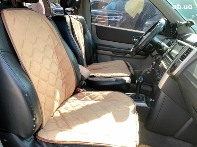 Черный Ниссан ИксТрейл, объемом двигателя 2.5 л и пробегом 295 тыс. км за 6890 $, фото 25 на Automoto.ua