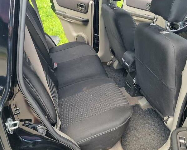 Черный Ниссан ИксТрейл, объемом двигателя 2.18 л и пробегом 210 тыс. км за 6400 $, фото 7 на Automoto.ua