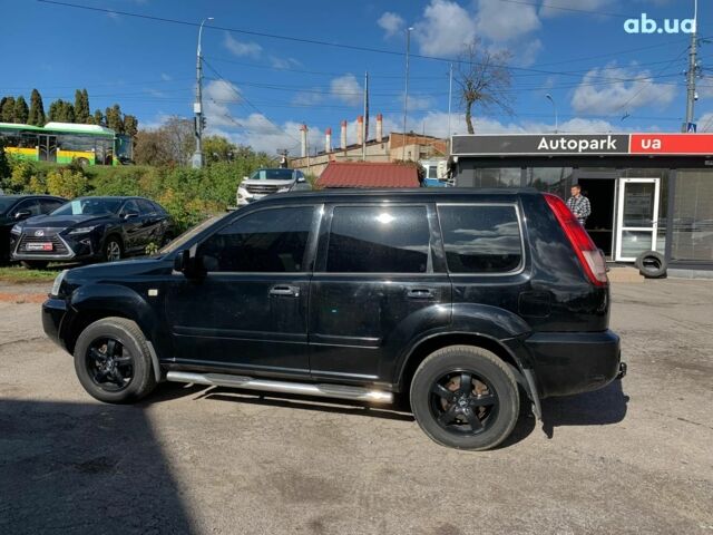 Черный Ниссан ИксТрейл, объемом двигателя 2.5 л и пробегом 295 тыс. км за 6890 $, фото 7 на Automoto.ua