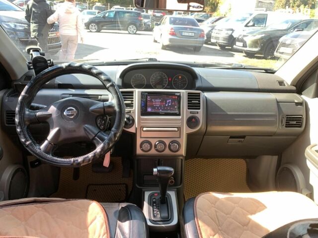 Черный Ниссан ИксТрейл, объемом двигателя 2.5 л и пробегом 295 тыс. км за 6890 $, фото 29 на Automoto.ua