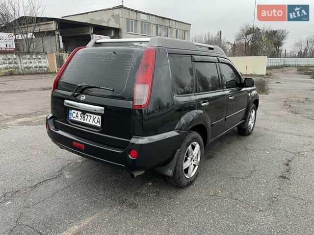 Черный Ниссан ИксТрейл, объемом двигателя 2.5 л и пробегом 285 тыс. км за 6500 $, фото 5 на Automoto.ua