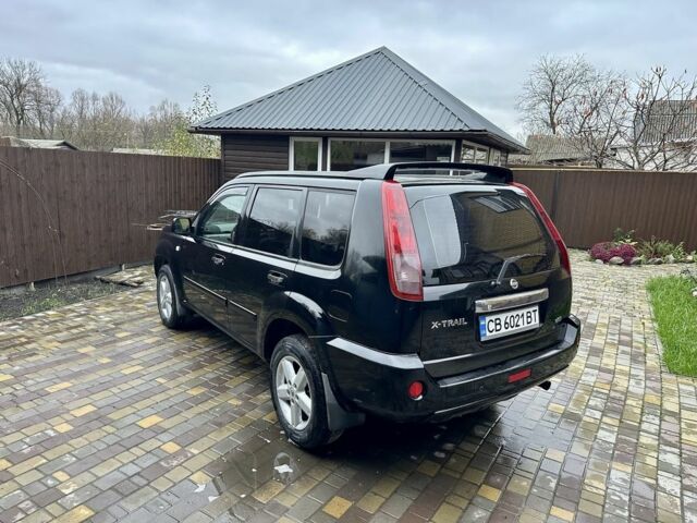 Черный Ниссан ИксТрейл, объемом двигателя 2.2 л и пробегом 168 тыс. км за 6699 $, фото 4 на Automoto.ua