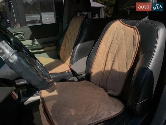Черный Ниссан ИксТрейл, объемом двигателя 2.5 л и пробегом 295 тыс. км за 6890 $, фото 31 на Automoto.ua