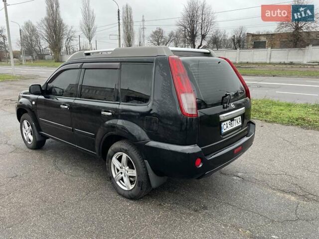 Черный Ниссан ИксТрейл, объемом двигателя 2.5 л и пробегом 285 тыс. км за 6500 $, фото 3 на Automoto.ua