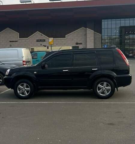 Черный Ниссан ИксТрейл, объемом двигателя 2.5 л и пробегом 261 тыс. км за 8300 $, фото 2 на Automoto.ua