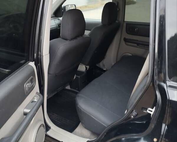 Черный Ниссан ИксТрейл, объемом двигателя 2.2 л и пробегом 373 тыс. км за 5800 $, фото 8 на Automoto.ua