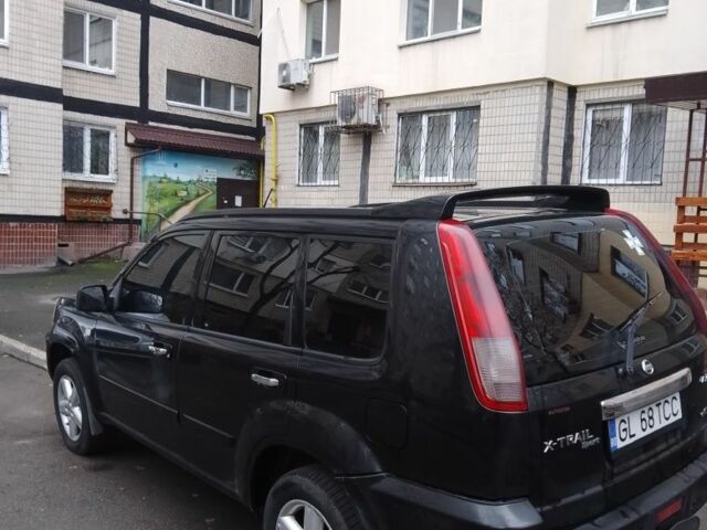 Черный Ниссан ИксТрейл, объемом двигателя 2.2 л и пробегом 260 тыс. км за 4500 $, фото 1 на Automoto.ua