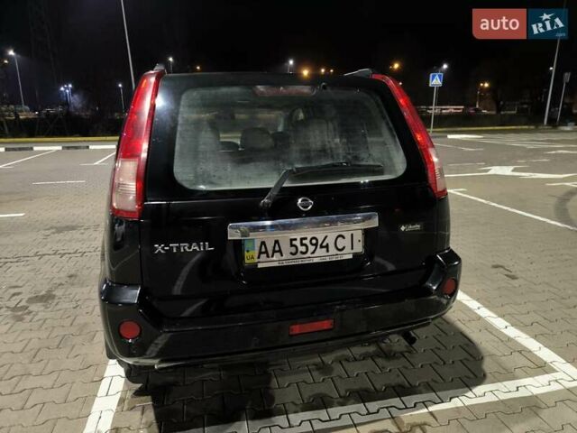 Черный Ниссан ИксТрейл, объемом двигателя 2.49 л и пробегом 128 тыс. км за 7500 $, фото 3 на Automoto.ua