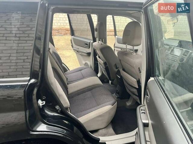 Черный Ниссан ИксТрейл, объемом двигателя 2 л и пробегом 150 тыс. км за 6500 $, фото 9 на Automoto.ua