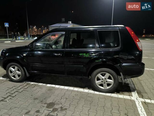 Черный Ниссан ИксТрейл, объемом двигателя 2.49 л и пробегом 128 тыс. км за 7500 $, фото 2 на Automoto.ua