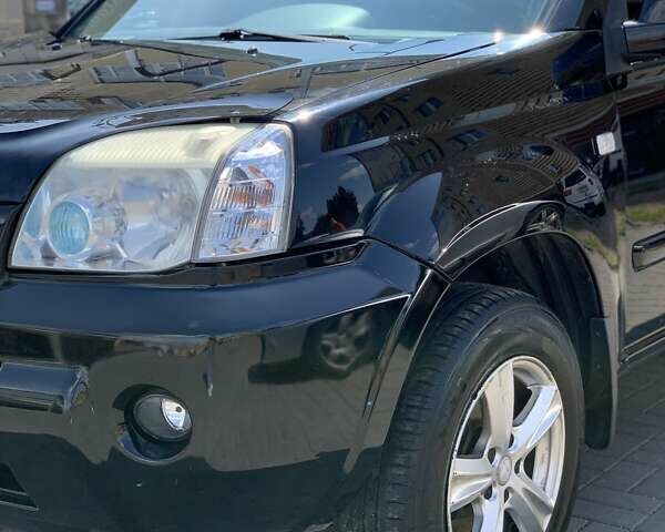 Черный Ниссан ИксТрейл, объемом двигателя 2.2 л и пробегом 227 тыс. км за 8300 $, фото 22 на Automoto.ua