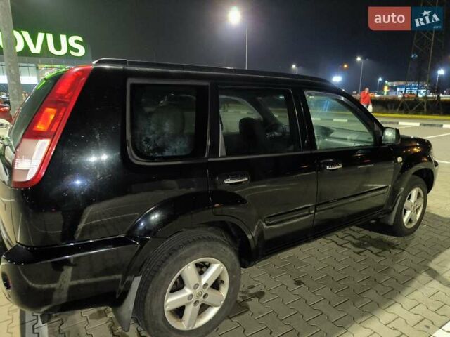 Черный Ниссан ИксТрейл, объемом двигателя 2.49 л и пробегом 128 тыс. км за 7500 $, фото 1 на Automoto.ua