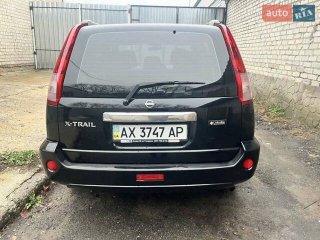 Черный Ниссан ИксТрейл, объемом двигателя 2 л и пробегом 150 тыс. км за 6500 $, фото 2 на Automoto.ua