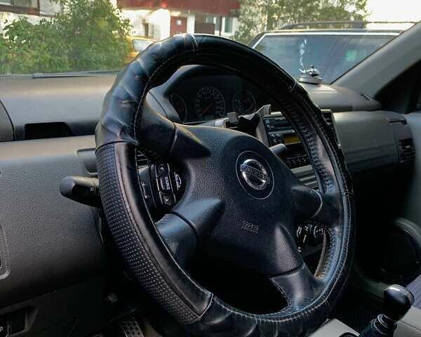 Черный Ниссан ИксТрейл, объемом двигателя 2.2 л и пробегом 227 тыс. км за 8300 $, фото 46 на Automoto.ua