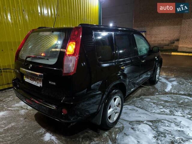 Черный Ниссан ИксТрейл, объемом двигателя 2.49 л и пробегом 128 тыс. км за 7500 $, фото 5 на Automoto.ua