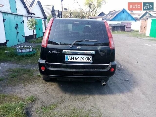 Черный Ниссан ИксТрейл, объемом двигателя 2.49 л и пробегом 203 тыс. км за 7000 $, фото 7 на Automoto.ua