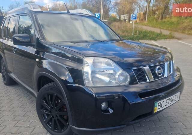 Чорний Ніссан ІксТрейл, об'ємом двигуна 2 л та пробігом 333 тис. км за 7450 $, фото 4 на Automoto.ua