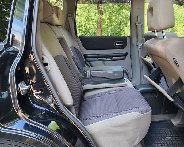 Черный Ниссан ИксТрейл, объемом двигателя 2.5 л и пробегом 170 тыс. км за 8500 $, фото 2 на Automoto.ua