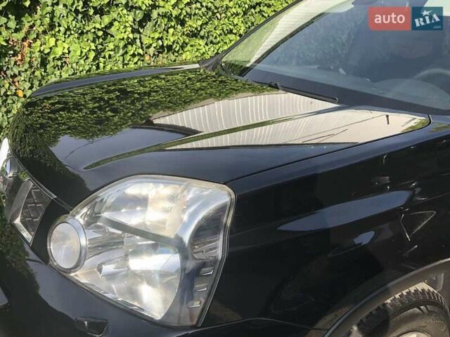 Черный Ниссан ИксТрейл, объемом двигателя 2 л и пробегом 140 тыс. км за 11600 $, фото 4 на Automoto.ua