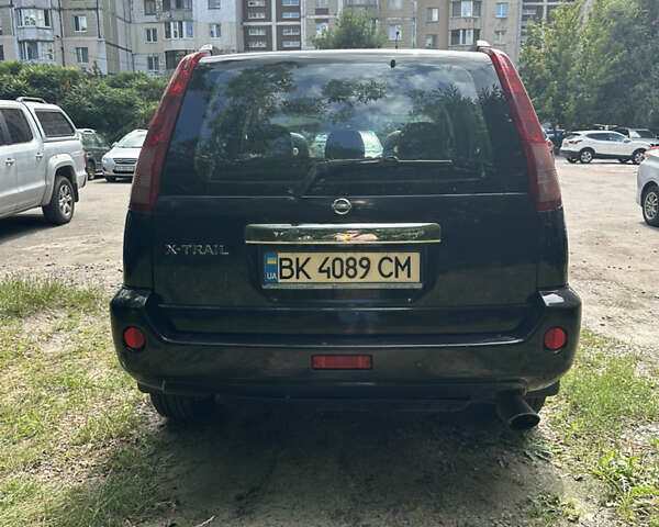 Чорний Ніссан ІксТрейл, об'ємом двигуна 2.49 л та пробігом 256 тис. км за 7000 $, фото 3 на Automoto.ua