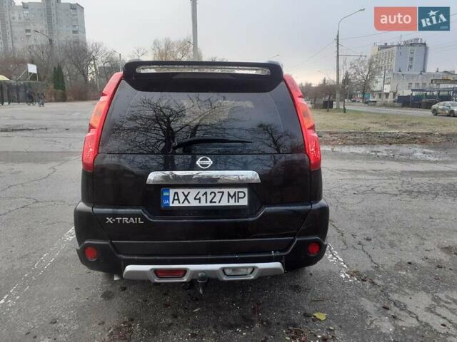 Черный Ниссан ИксТрейл, объемом двигателя 2.49 л и пробегом 185 тыс. км за 9100 $, фото 5 на Automoto.ua