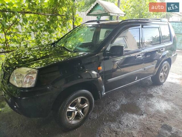 Черный Ниссан ИксТрейл, объемом двигателя 2.49 л и пробегом 195 тыс. км за 5200 $, фото 1 на Automoto.ua