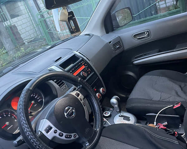 Черный Ниссан ИксТрейл, объемом двигателя 2.5 л и пробегом 236 тыс. км за 8600 $, фото 11 на Automoto.ua