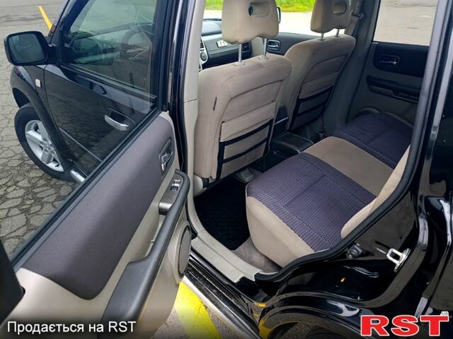 Черный Ниссан ИксТрейл, объемом двигателя 2.5 л и пробегом 170 тыс. км за 8600 $, фото 10 на Automoto.ua