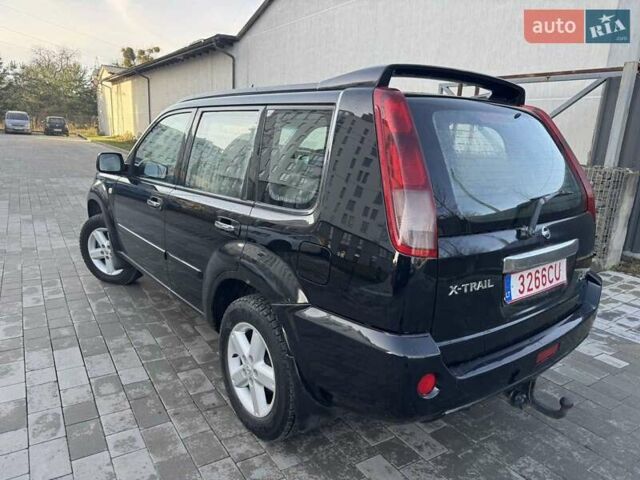 Чорний Ніссан ІксТрейл, об'ємом двигуна 2.2 л та пробігом 295 тис. км за 3850 $, фото 2 на Automoto.ua